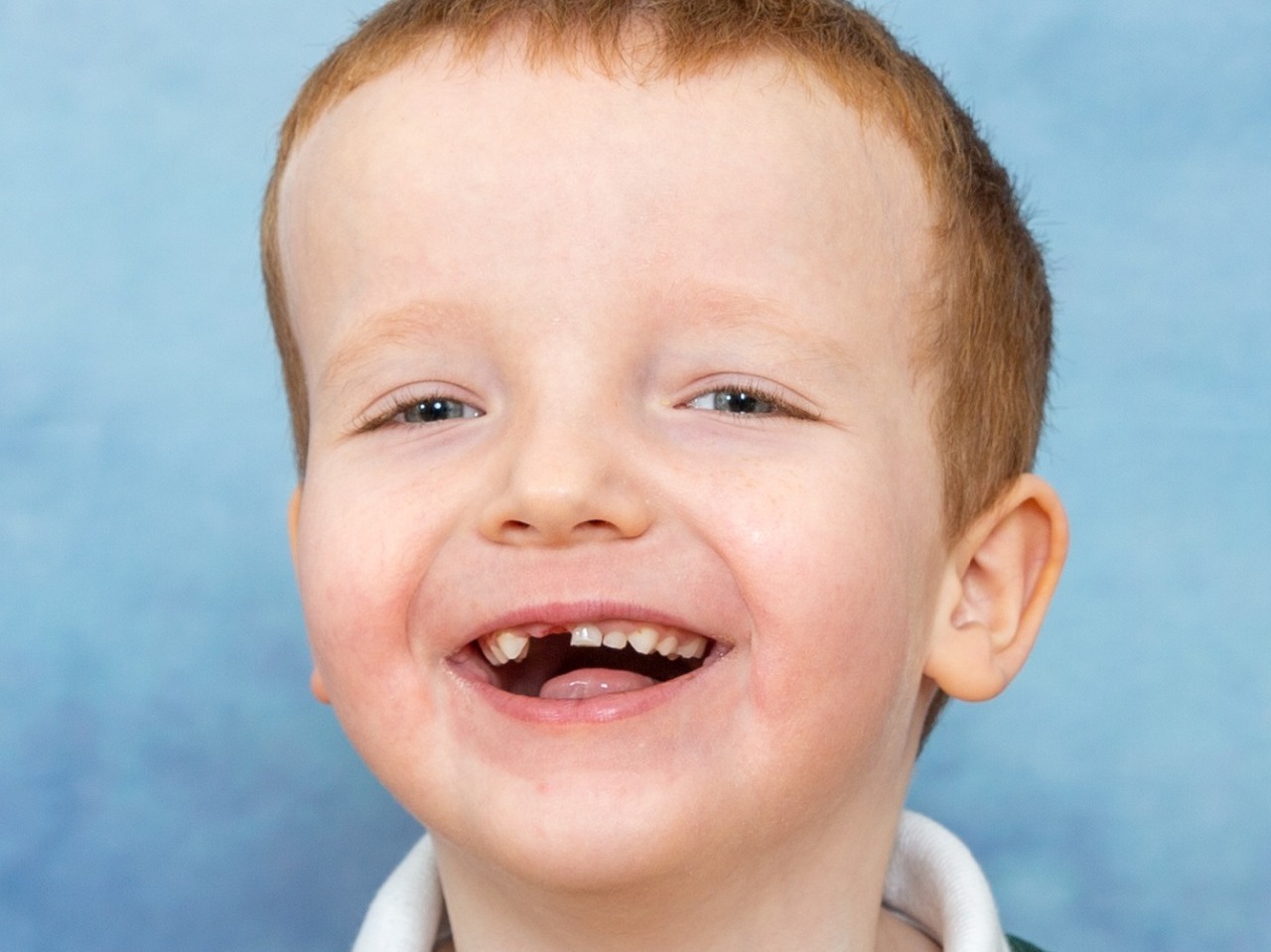 Happy smiles all around from this young lad at Tiverton School having his formal school photos