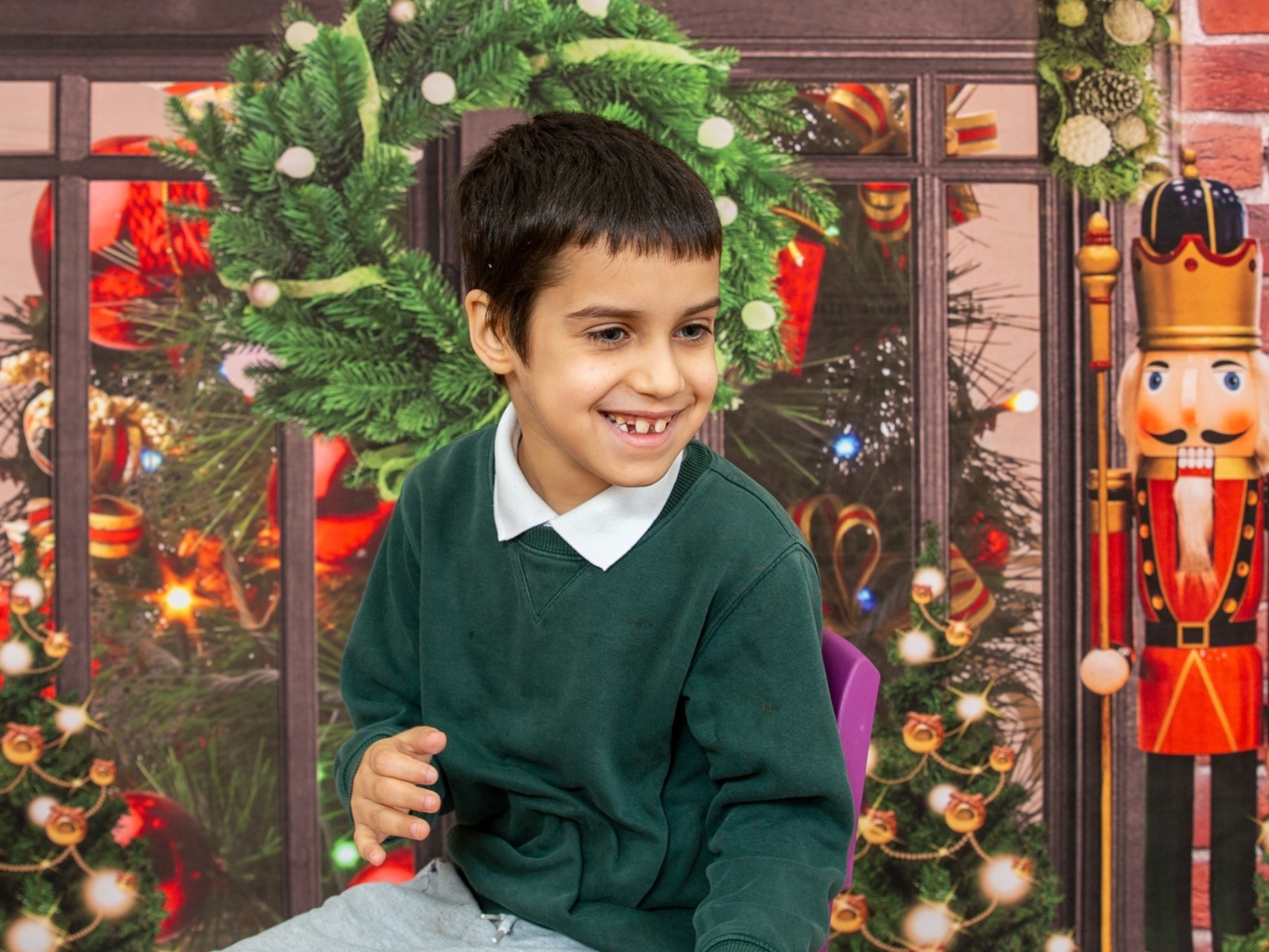 It's the most wonderful time of the year. This young lad thinks so posing in front of our santa's grotto SEN shoot