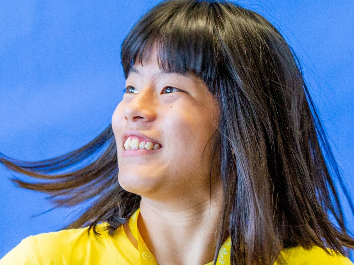 Teenage Asian girl with learning difficulties with beautiful smile college photograph