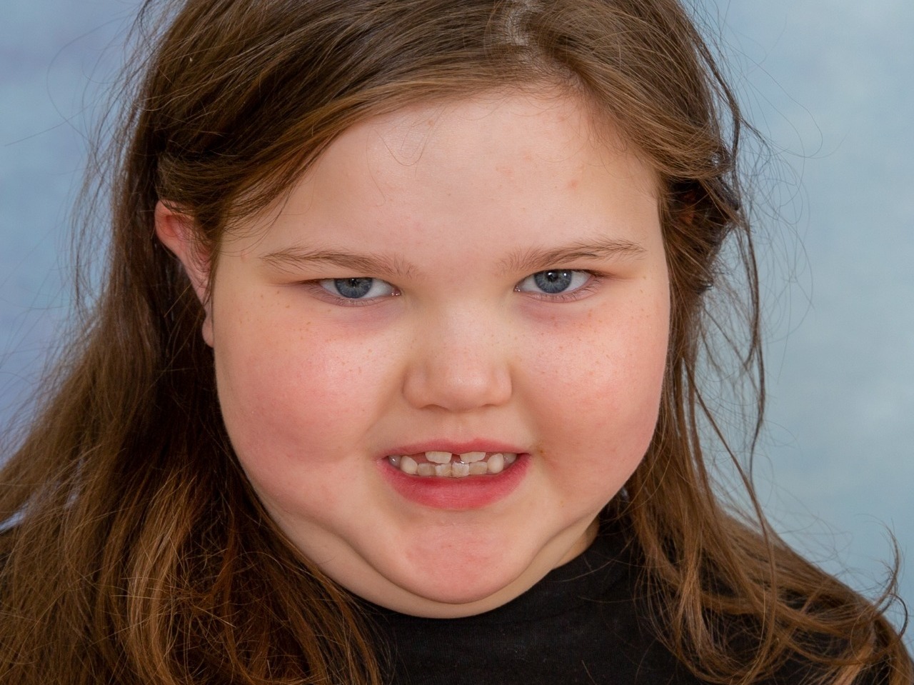 Gorgeous young lady having her autistic friendly photo session at school