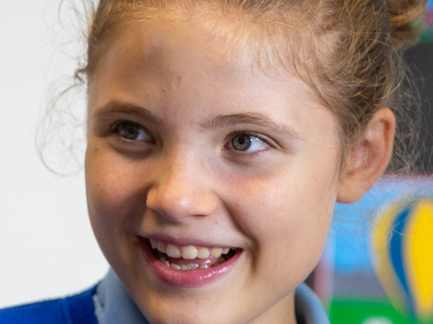 Violet is an young girl with learning difficulties having her school photo