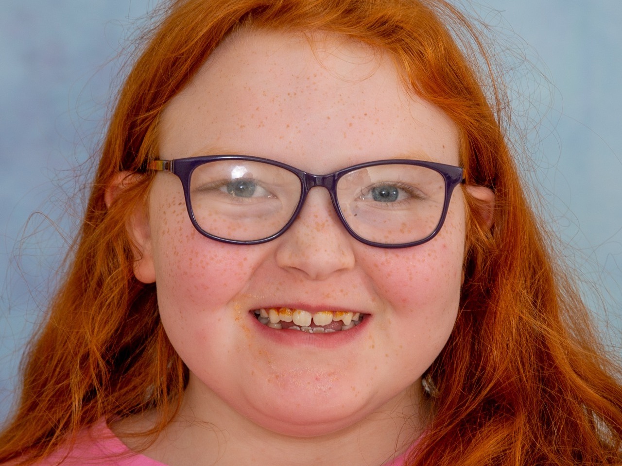 Beautiful red haired girl with autism having her SEN school photo