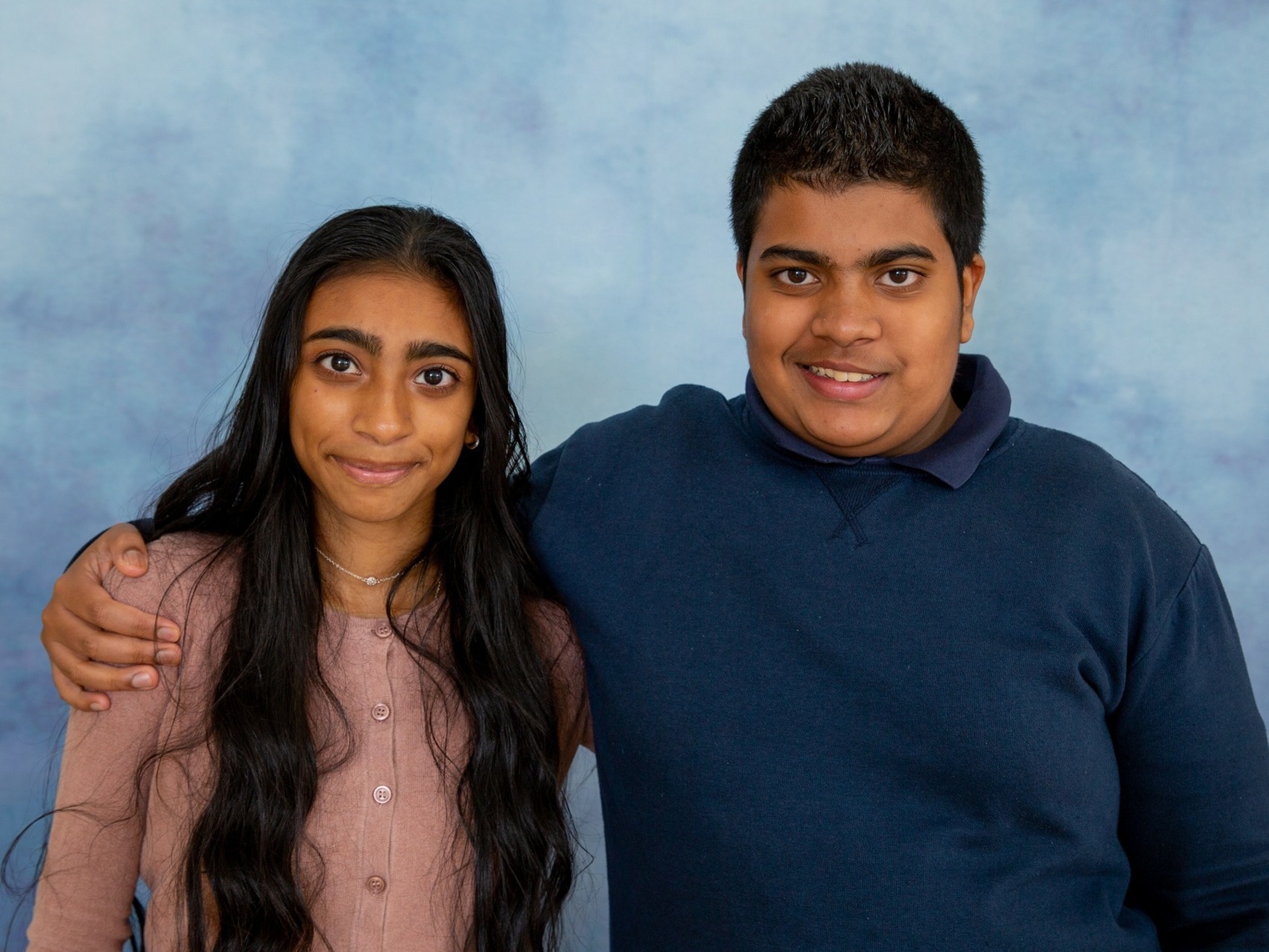 Sibling love - brother and sister sharing a school photo in our Special Educational Needs photo sessions
