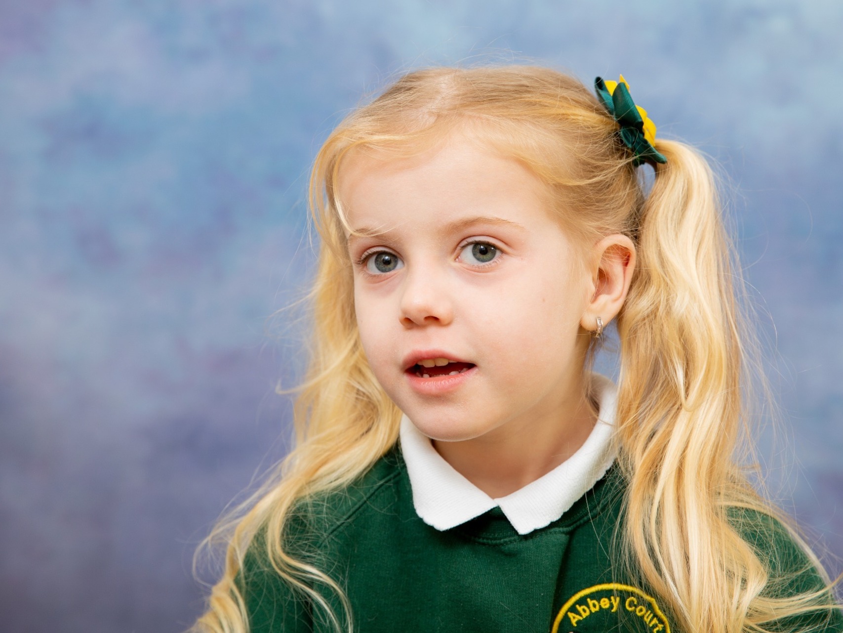 Stunning young girl having her formal school photograph at Abbey Court, Kent
