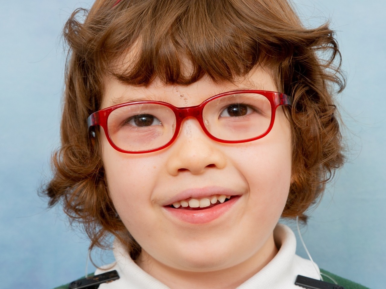 Beautiful young lady with special needs having her formal school photo