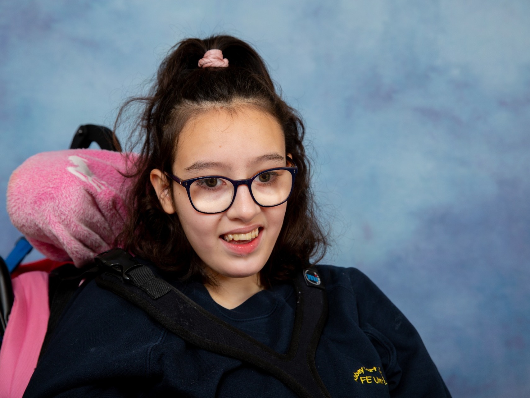 Natural and organic photograph of this young disabled girl in her school portrait