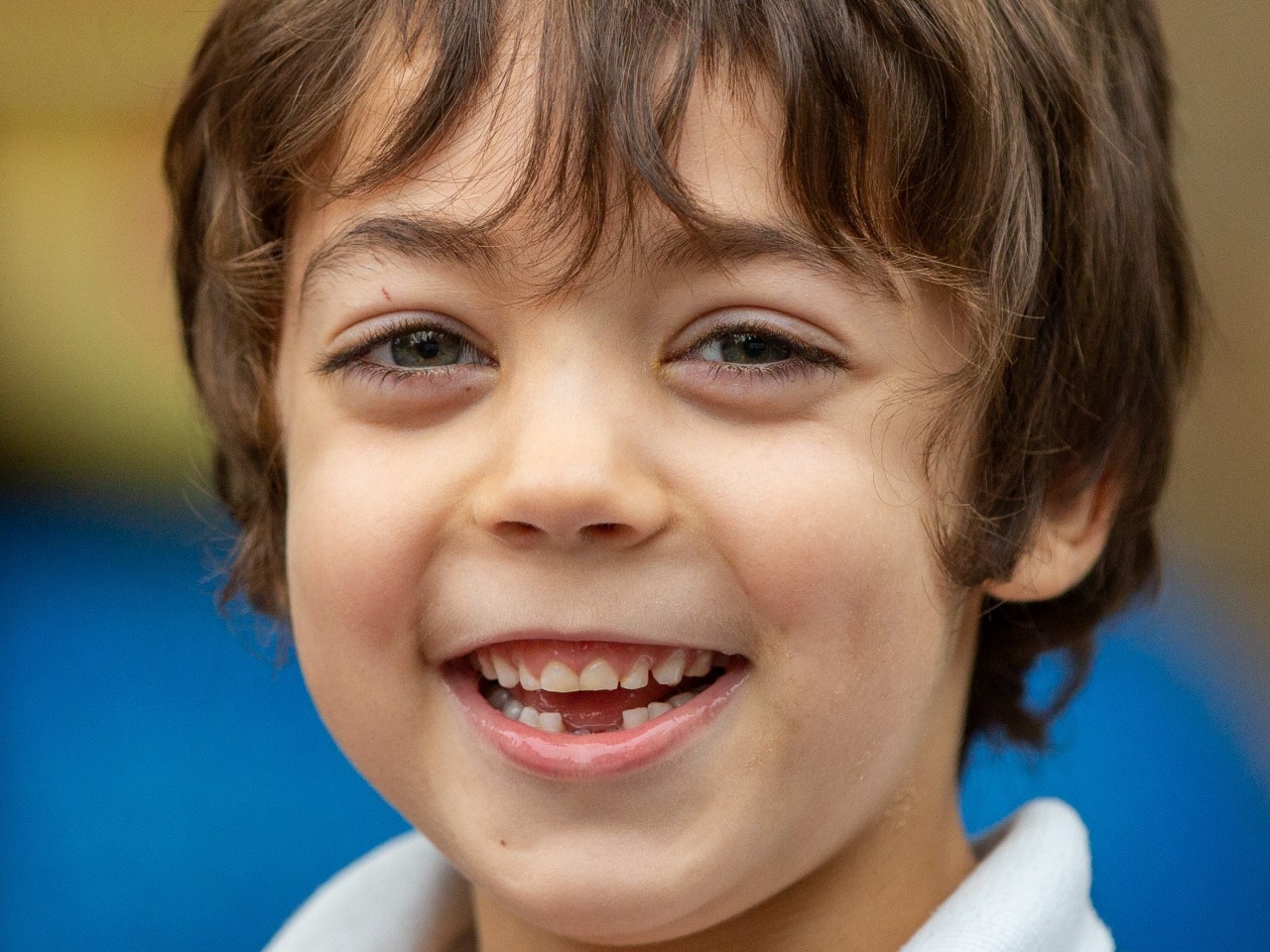 Lovely toothless grin from this striking young boy