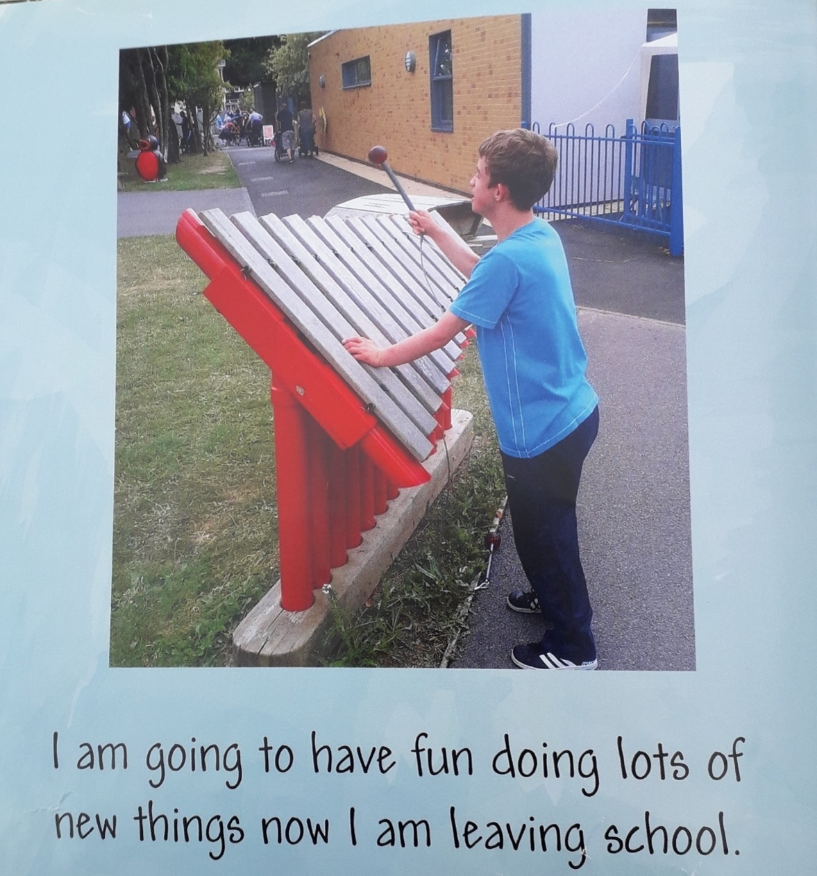 A page from James' Snapfish book, playing the xylophone at school.