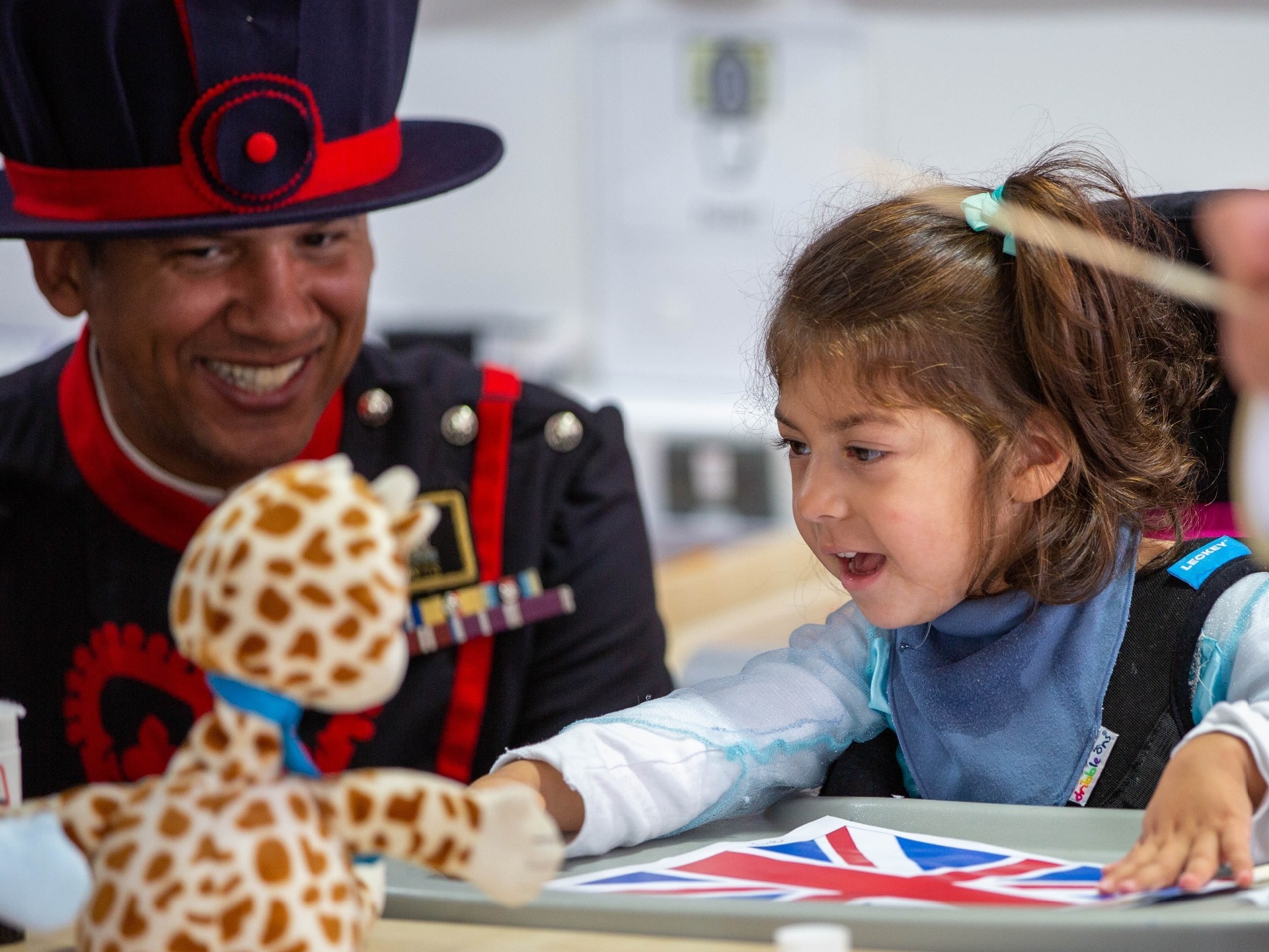 HR Beefeater visiting a disabled girl in a wheelchair at British Values Day Lonsdale School