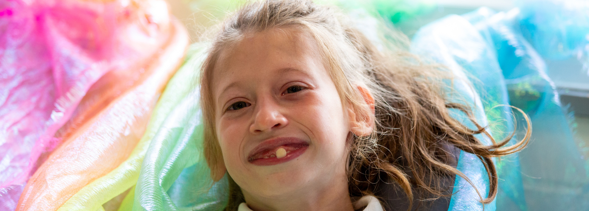 Young girl at a special needs school having her candid school photography session. East Sussex