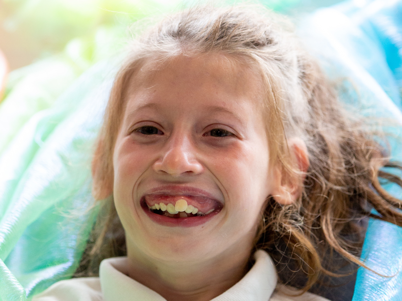 A beautiful smile from a young lady with special needs at a school photography session in East Sussex