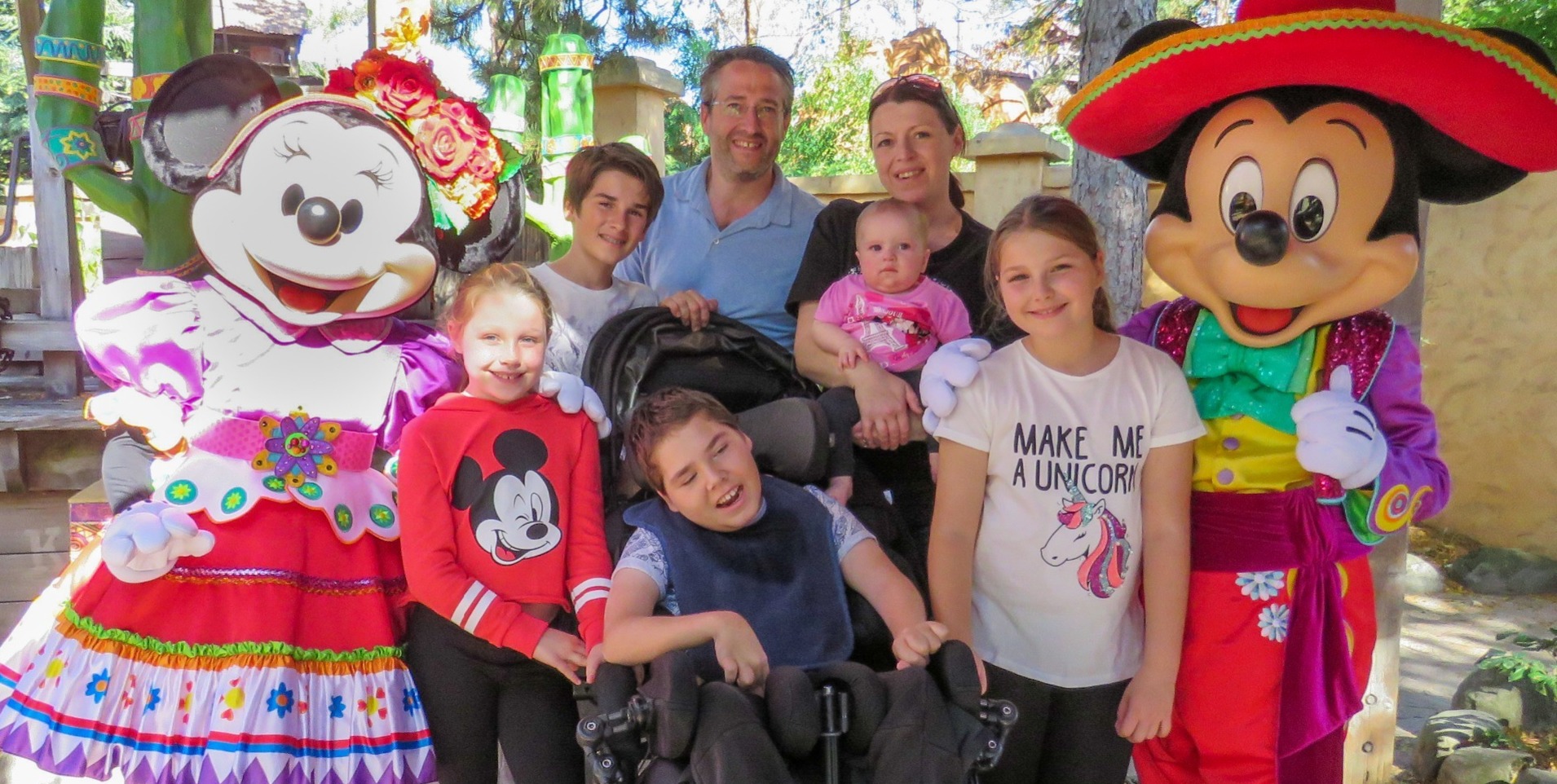 Star Wars Disneyland Paris teenage boy in wheelchair having a photo with his family and Darth Vader - Life with the Merrys