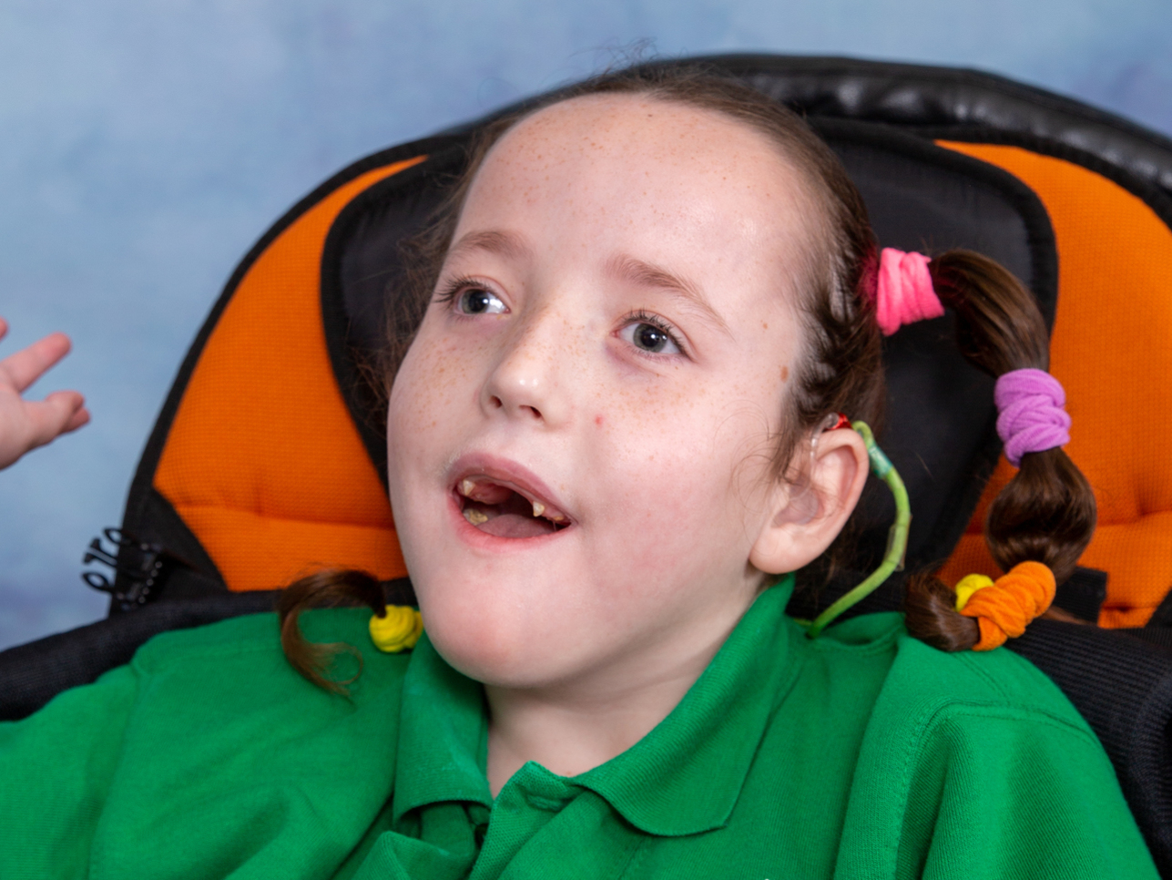 Young disabled girl posing for her school photo in Walsall