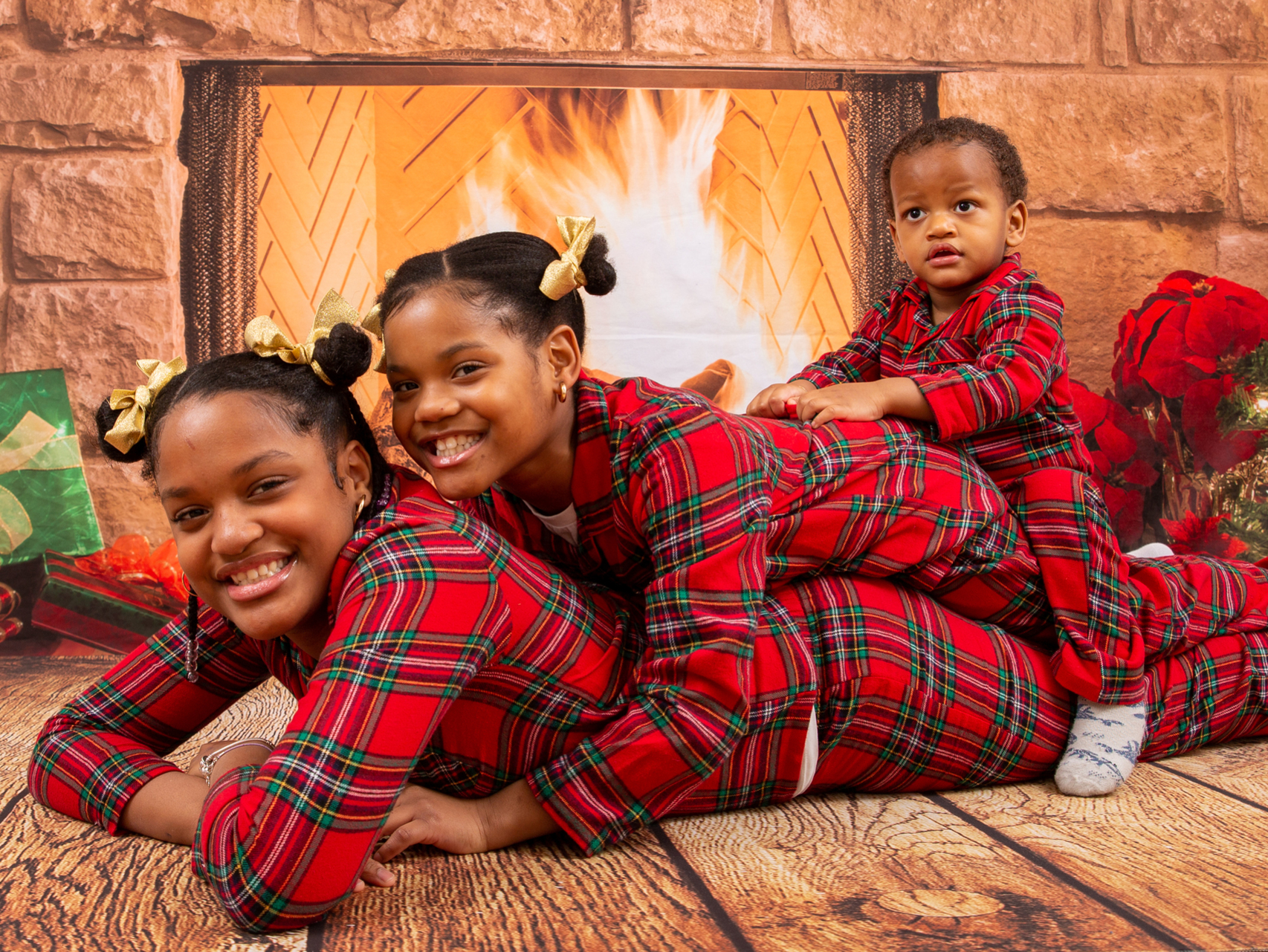 Siblings matching PJs Christmas family portrait session